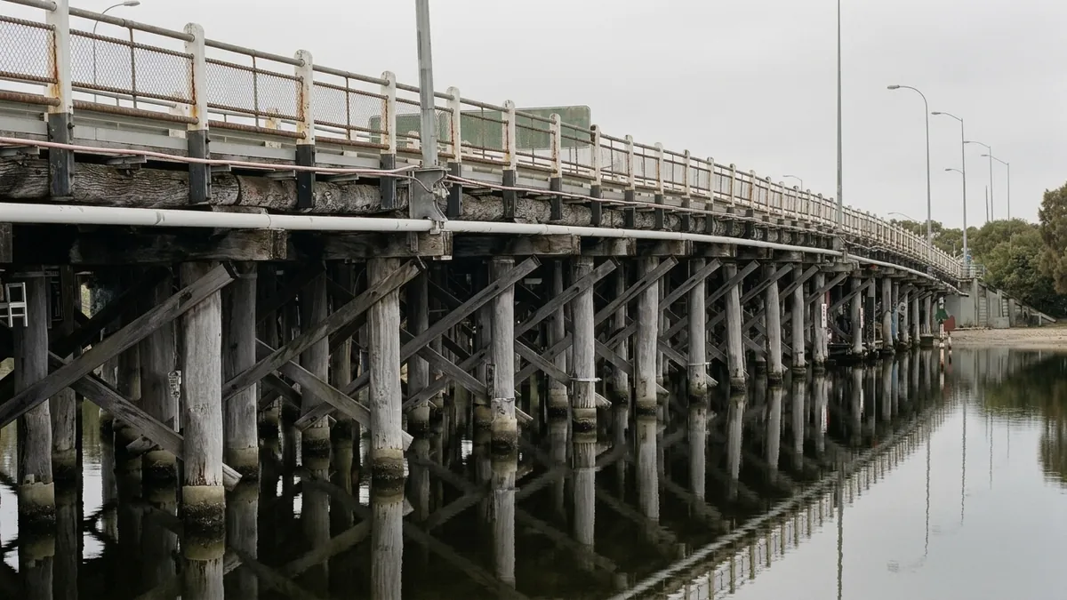 Timber Canning Bridge over the Swan River at Como, Perth, the riverside setting of the South Perth market Search Scope serves