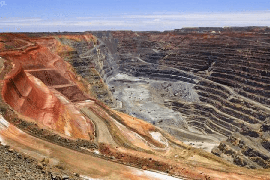 Vast open-pit mine with layered geological formations