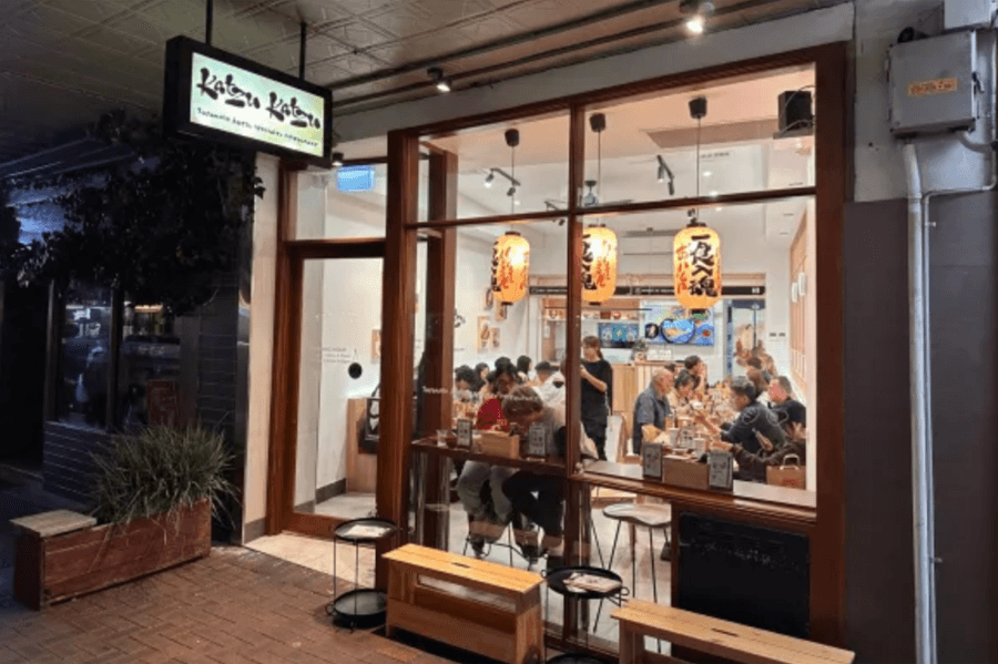 Busy Japanese restaurant in Sydney at night.